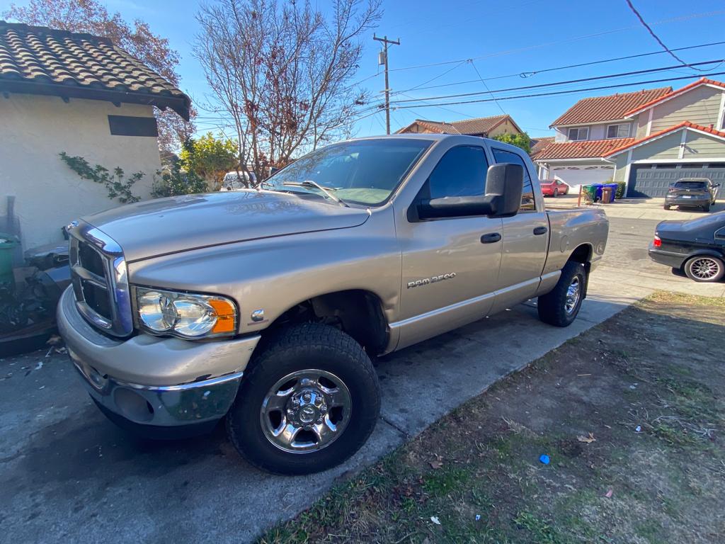 Tan Dodge Ram 2500 crew cab with freshly tinted windows