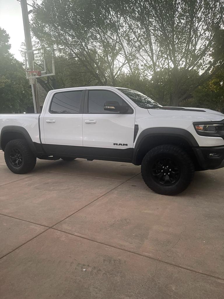 White Ram 1500 TRX pickup with tinted crew cab windows