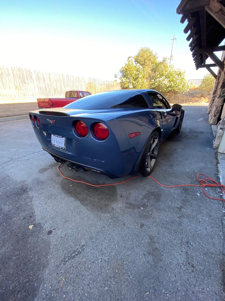 Blue Chevrolet Corvette with freshly tinted rear and side glass