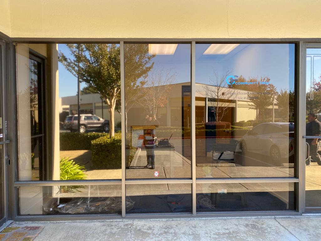 Office storefront glass with bronze solar film installed